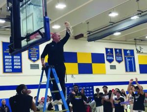 Men’s basketball captures East district title